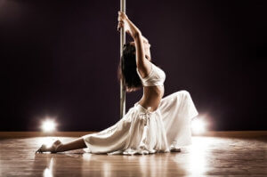 Young pole dance woman